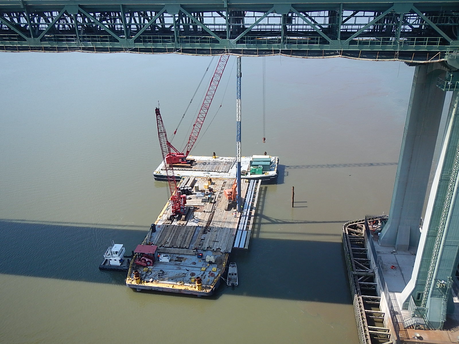 https://www.drba.net/sites/default/files/2023-07/barge_crane_for_wick_drain_install.jpg