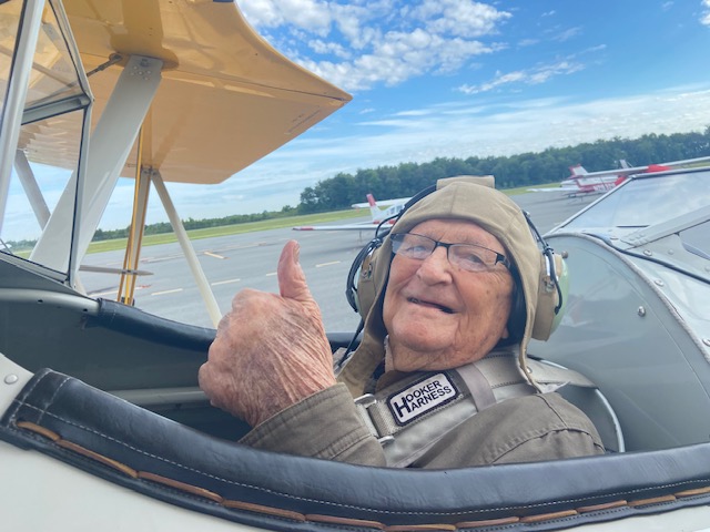 Vet gives a thumbs up in the Dream Flights plane