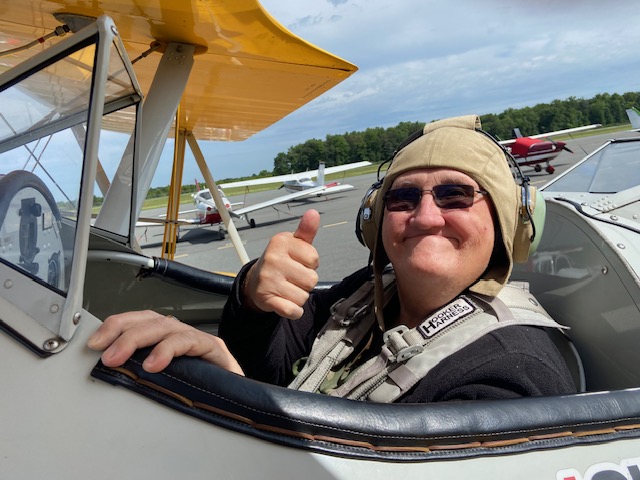 Vet gives a thumbs up in the Dream Flights plane