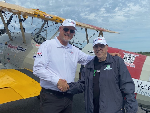 Vet shakes hands with a Dream Flights Administrator
