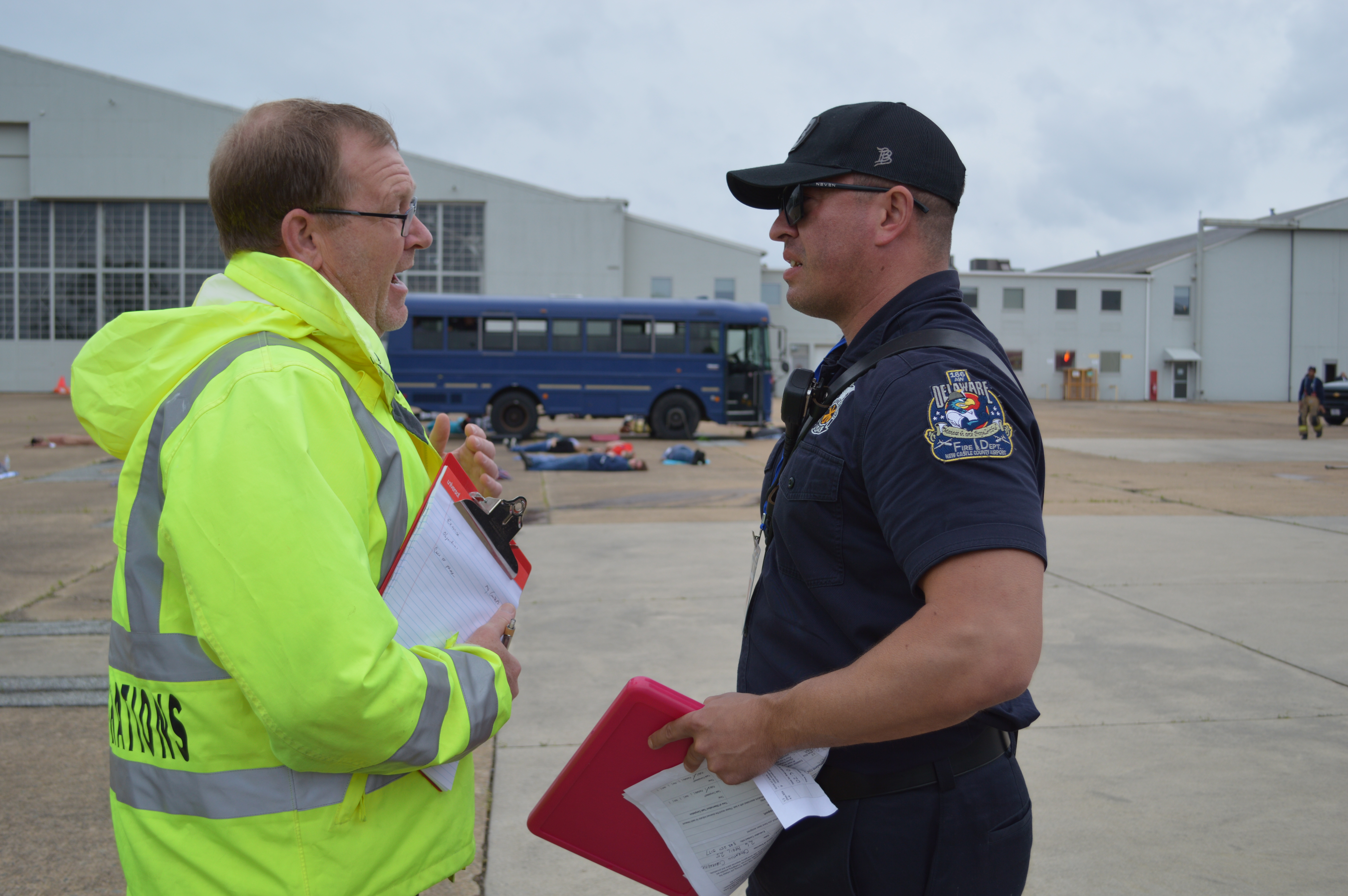 Airport Director Ben Clendaniel chats with emergency personell during the drill