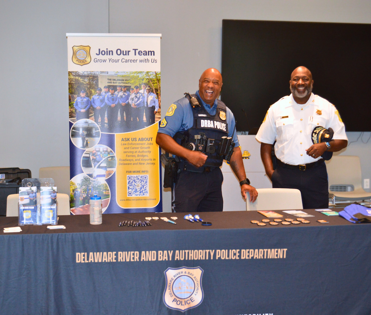 DRBA police smile at their job fair booth