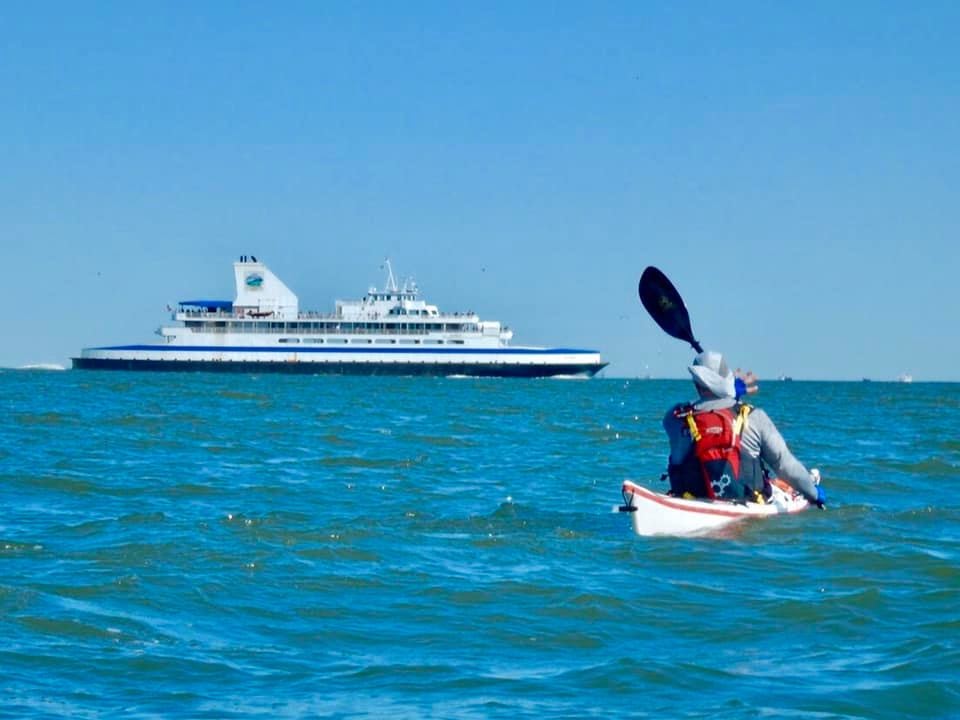 Operation Deep Blue kayakers paddling past Cape May - Lewes Ferry