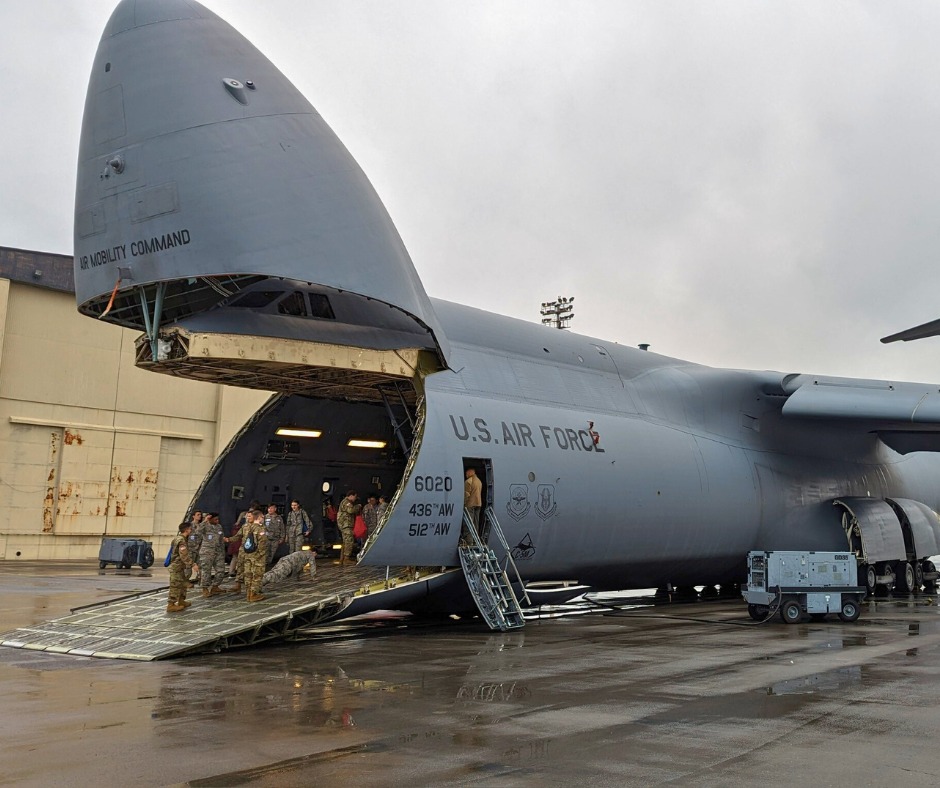 Picture of a military cargo plane with the nose open; an exhibit at the Tuskeegee event